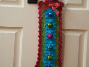 Free Jingle Bells Door Hanger Crochet Pattern from RedHeart.com